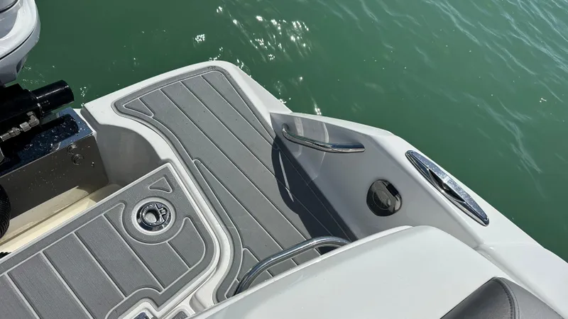 Slide: The Image of 2018 Nor-Tech 340 Sport Center Console boat deck with gray non-slip surface. - 36
