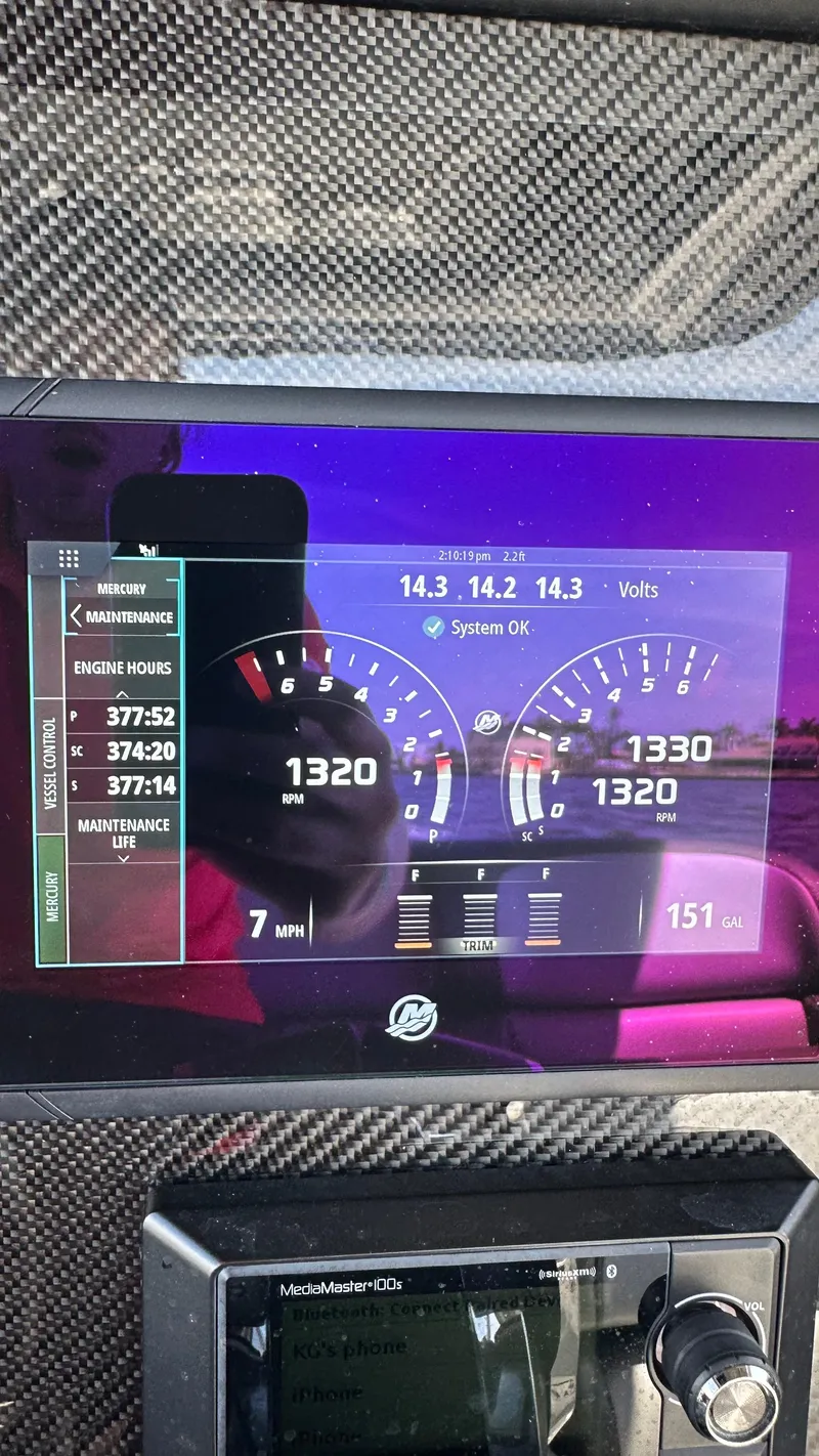 Slide: The Image of Dashboard of 2018 Nor-Tech 340 Sport Center Console with digital gauges and controls. - 38