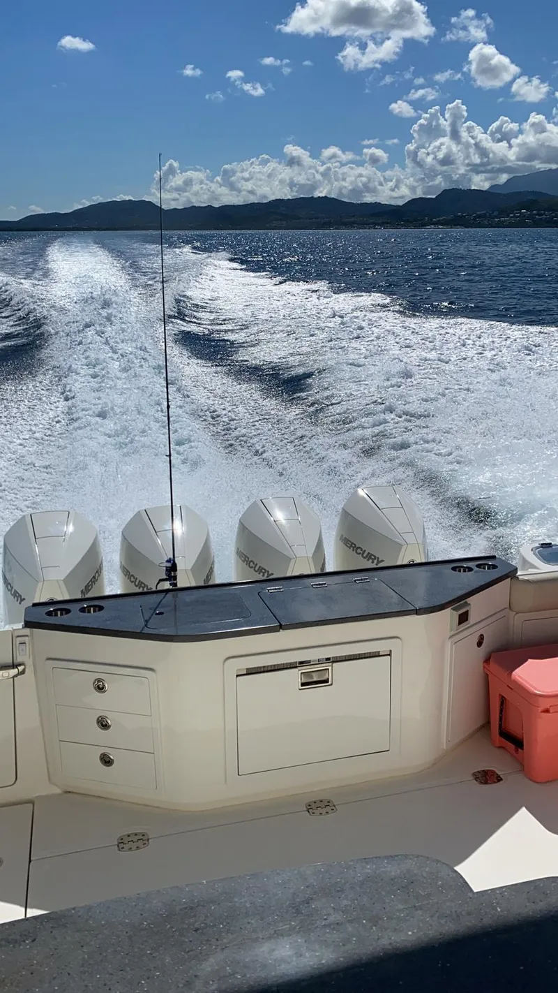 Slide: The Image of Boston Whaler 405 Conquest 2021 cruising on open water with powerful engines. - 8