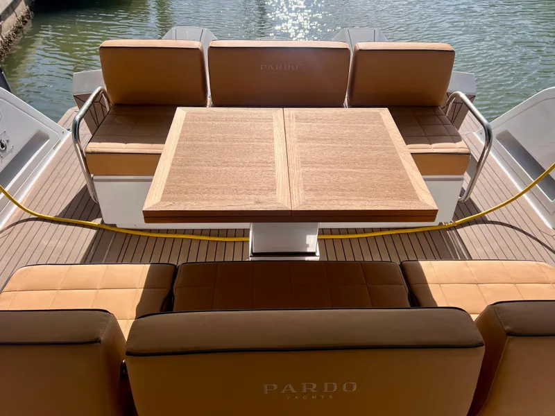 Slide: The Image of 2024 Pardo Yachts P38 interior with elegant seating and wooden table on deck. - 15