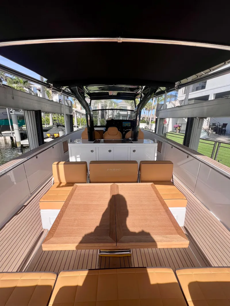 Slide: The Image of 2024 Pardo Yachts P38 interior with elegant seating and wooden table. - 16