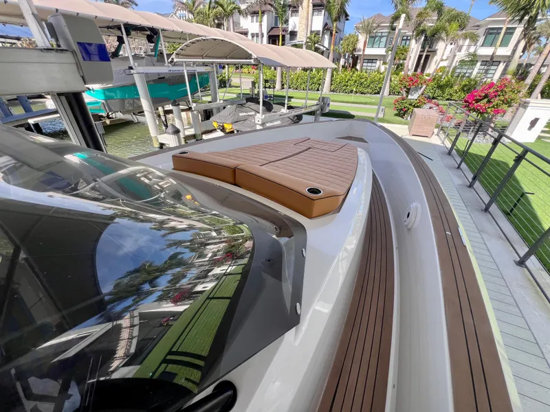 Slide: The Image of 2024 Pardo Yachts P38 docked, showcasing sleek design and luxurious deck features. - 17