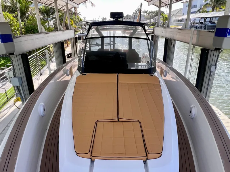 Slide: The Image of 2024 Pardo Yachts P38 on a lift, featuring sleek design and spacious deck. - 20