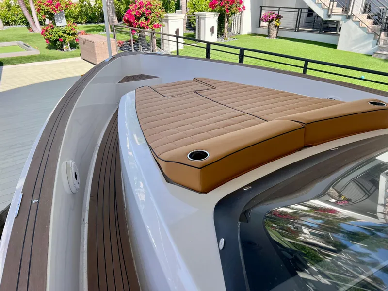 Slide: The Image of 2024 Pardo Yachts P38 deck with cushioned seating and sleek design. - 22