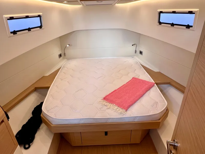 Slide: The Image of 2024 Pardo Yachts P38 cabin interior with bed and windows. - 25
