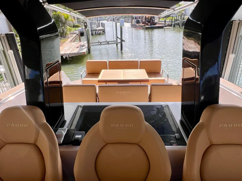 Slide: The Image of 2024 Pardo Yachts P38 interior with leather seats and waterfront view. - 27