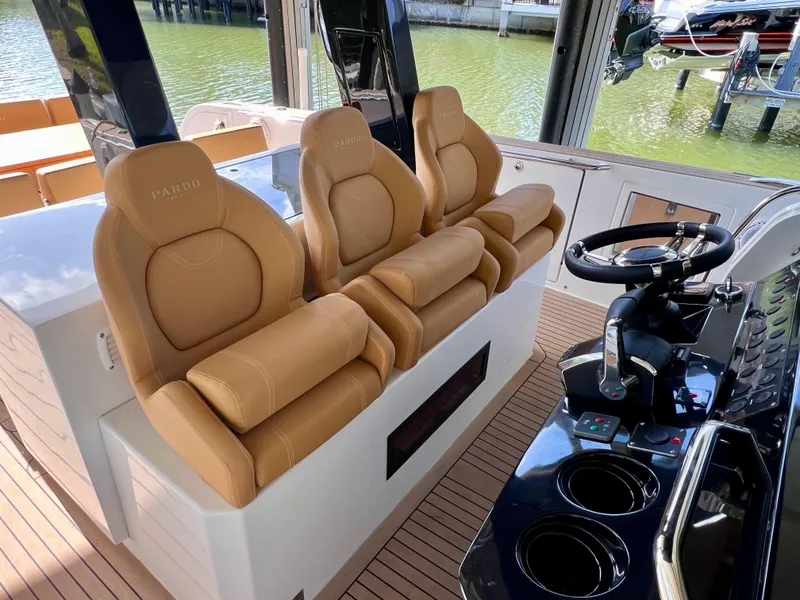 Slide: The Image of 2024 Pardo Yachts P38 interior with tan leather seats and modern steering console. - 3