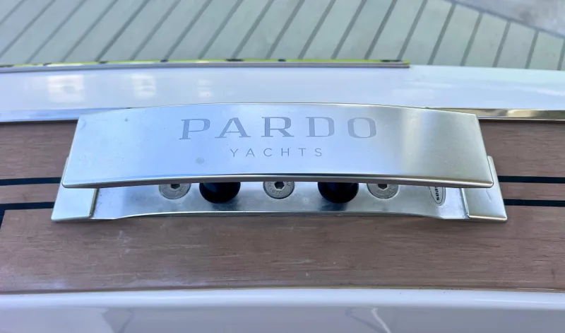 Slide: The Image of Pardo Yachts P38 2024 model, featuring sleek metallic branding on wooden deck. - 37