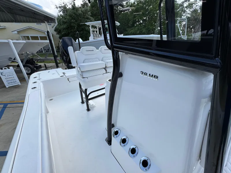 Slide: The Image of 2025 Caymas 28 HB boat interior with seating and control panel. - 30