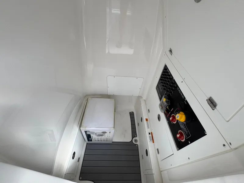 Slide: The Image of 2025 Caymas 28 HB interior with control panel and storage area. - 31
