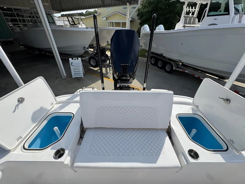 Slide: The Image of 2025 Caymas 28 HB boat interior with seating and storage compartments. - 41