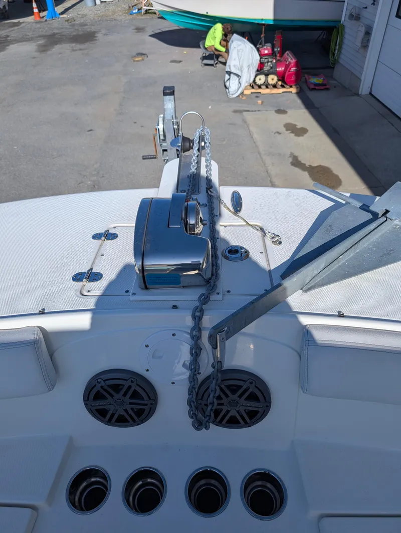 Slide: The Image of 2018 World Cat 230DC boat deck with anchor and chain mechanism. - 19