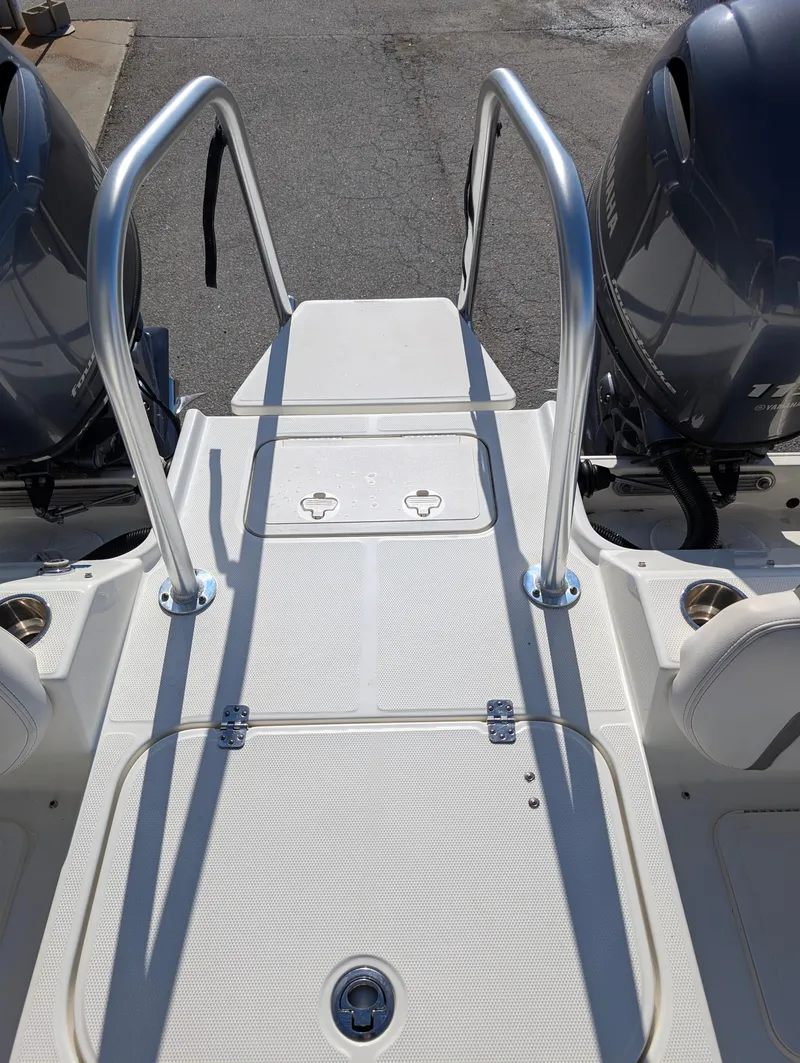 Slide: The Image of 2018 World Cat 230DC boat with dual engines and sturdy rear platform. - 24