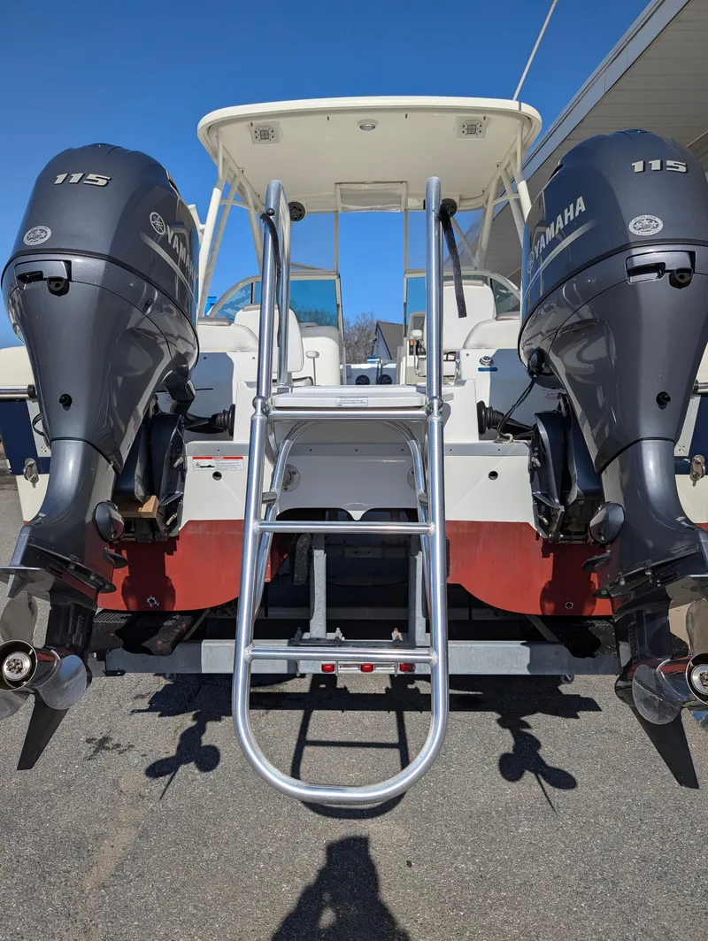 Slide: The Image of 2018 World Cat 230DC boat with dual Yamaha 115 engines and rear ladder. - 27