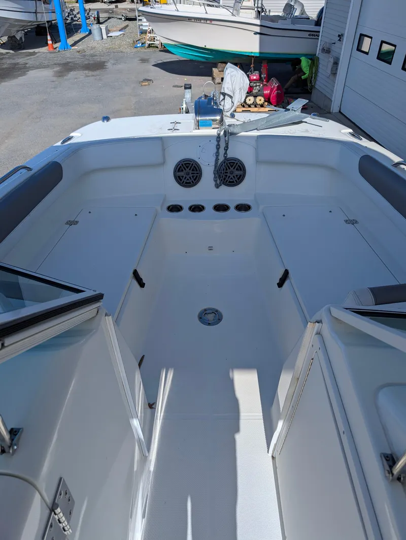 Slide: The Image of 2018 World Cat 230DC boat interior, featuring spacious seating and modern design elements. - 8