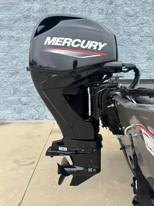 Slide: The Image of 2025 Lowe Skorpion 16 boat with Mercury outboard motor, parked on concrete surface. - 8