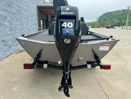 Slide: The Image of 2025 Lowe Skorpion 16 boat with Mercury 40 engine, parked outdoors. - 9