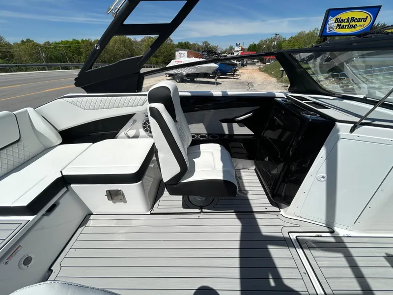 Slide: The Image of 2025 Yamaha Boats 222S interior with sleek seating and modern dashboard design. - 10