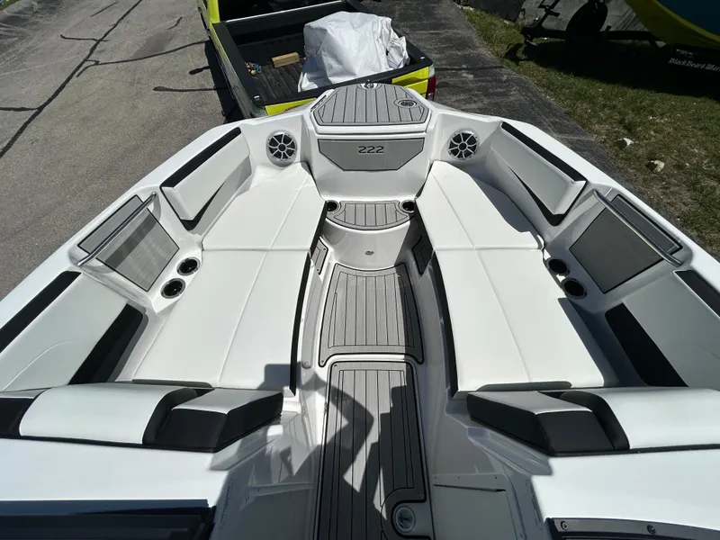 Slide: The Image of 2025 Yamaha Boats 222S interior, featuring spacious seating and modern design elements. - 11