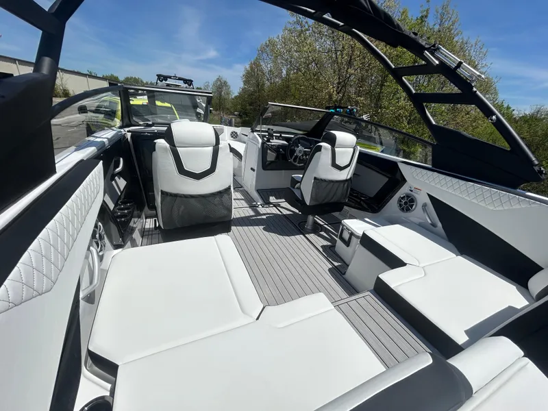 Slide: The Image of 2025 Yamaha Boats 222S interior, featuring sleek white seating and modern design elements. - 6