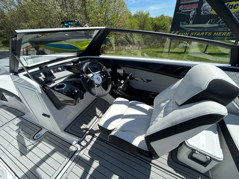 Slide: The Image of 2025 Yamaha Boats 222S cockpit with sleek design, modern controls, and comfortable seating. - 8