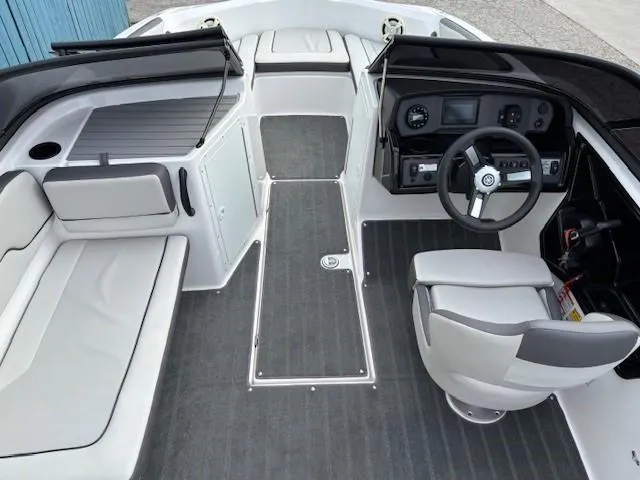 Slide: The Image of 2022 Yamaha Boats AR190 interior with steering wheel, seating, and dashboard controls. - 11