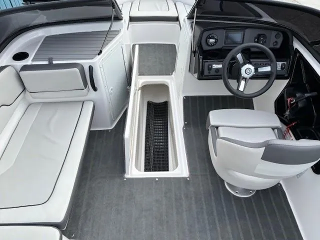 Slide: The Image of 2022 Yamaha Boats AR190 interior with seating, steering wheel, and storage compartment. - 12