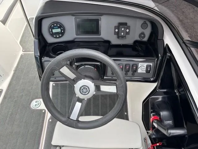 Slide: The Image of 2022 Yamaha AR190 boat dashboard with steering wheel and control panel. - 14