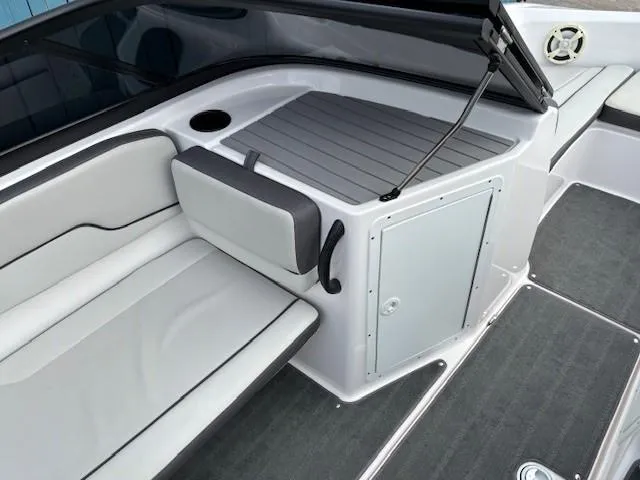 Slide: The Image of 2022 Yamaha Boats AR190 interior with sleek seating and storage compartment. - 16