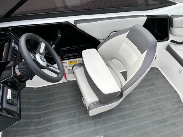 Slide: The Image of 2022 Yamaha Boats AR190 interior with steering wheel and cushioned seat. - 20