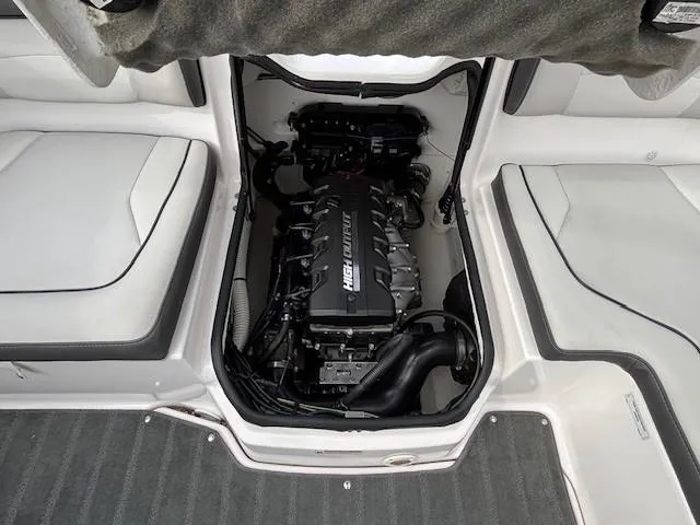 Slide: The Image of 2022 Yamaha AR190 boat engine compartment with high output engine, surrounded by white seating. - 29