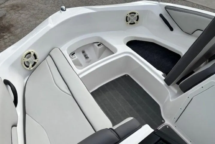 Slide: The Image of 2022 Yamaha Boats AR190 interior with seating and speakers, showcasing modern design and comfort. - 9
