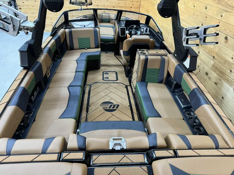 Slide: The Image of 2023 Malibu 25 LSV boat interior with luxurious seating and modern design. - 5