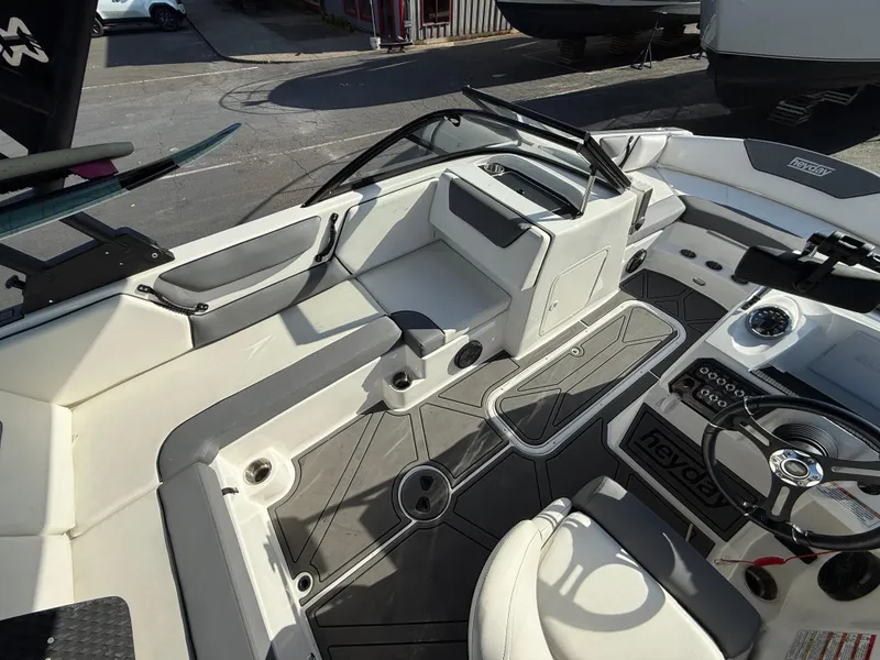 Slide: The Image of 2023 Heyday WT-2DC boat interior with modern dashboard and seating. - 11
