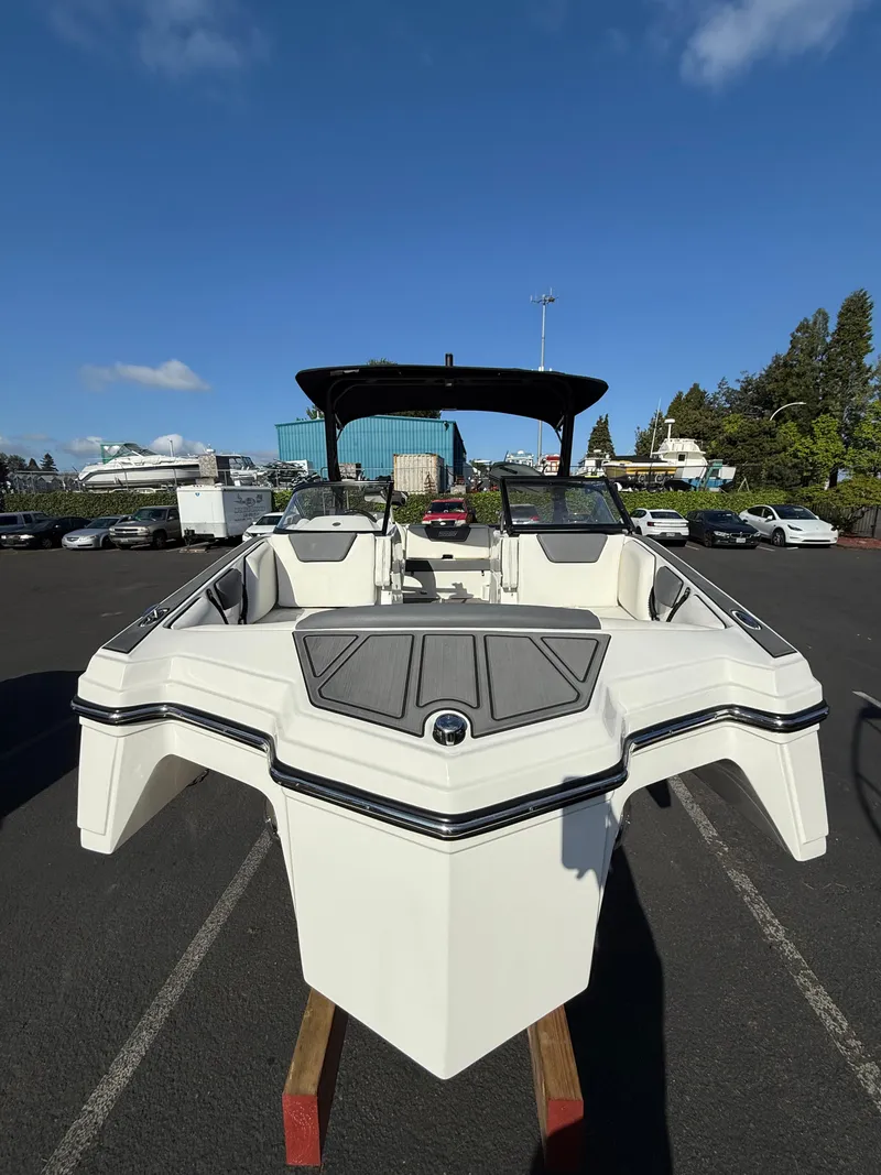 Slide: The Image of 2023 Heyday WT-2DC boat on display in a parking lot under clear skies. - 3