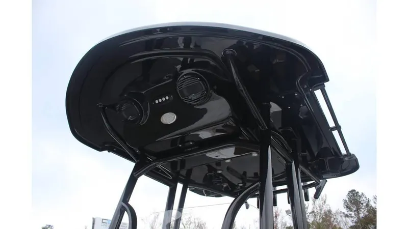 Slide: The Image of 2025 Sea Pro 230 Bay boat's sleek black T-top with integrated speakers. - 6