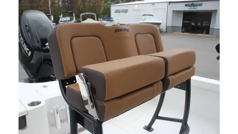 Slide: The Image of 2025 Sea Pro 230 Bay boat seat with brown upholstery and sleek design. - 9