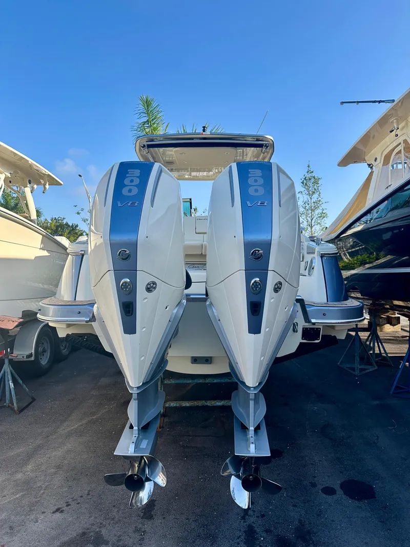 Slide: The Image of 2025 Chris-Craft Launch GT 31 with dual 300 V8 engines, docked under clear blue sky. - 4