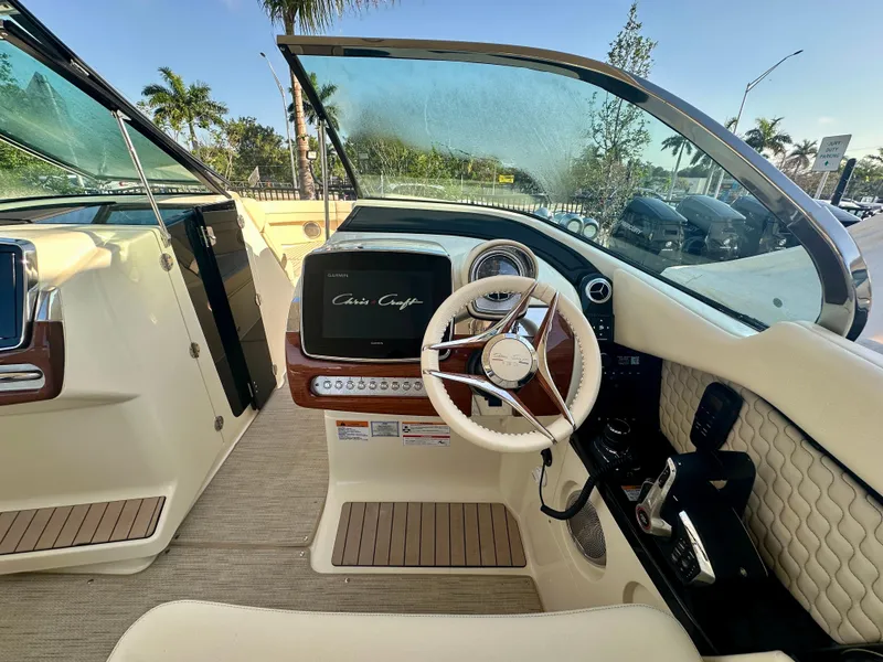 Slide: The Image of 2025 Chris-Craft Launch GT 31 cockpit with modern steering and dashboard, featuring luxurious design elements. - 5