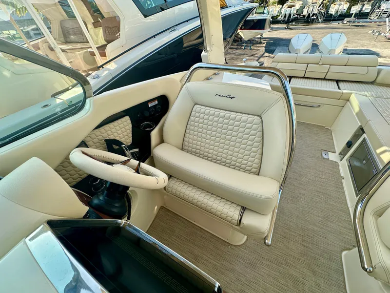 Slide: The Image of Luxurious interior of 2025 Chris-Craft Launch GT 31 boat with elegant seating and steering wheel. - 6