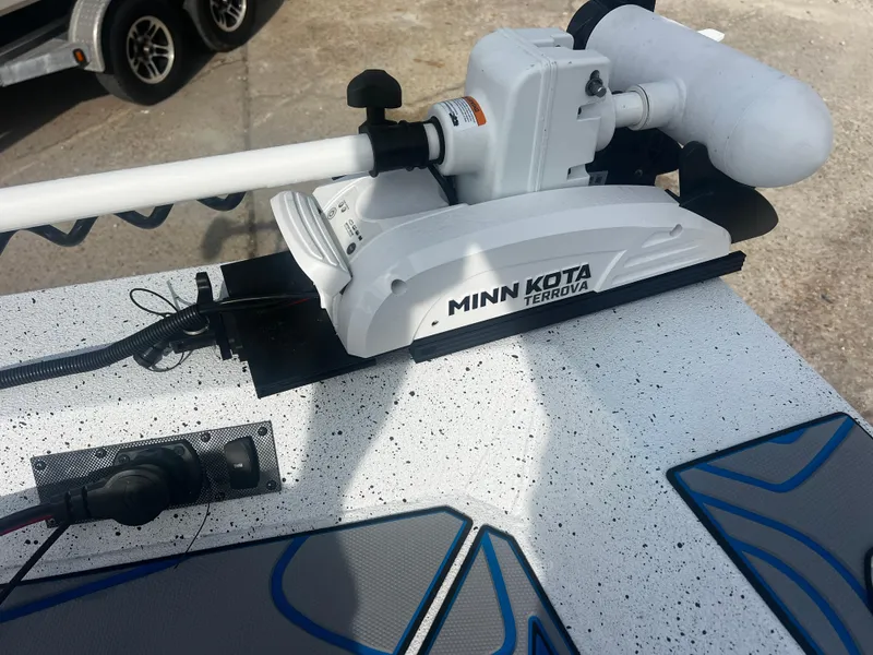 Slide: The Image of Minn Kota Terrova motor on 2023 Xpress X23B Lounge boat deck. - 10