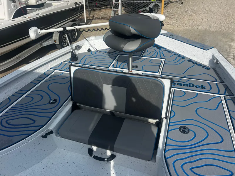 Slide: The Image of 2023 Xpress X23B Lounge boat with stylish seating and SeaDek flooring. - 11