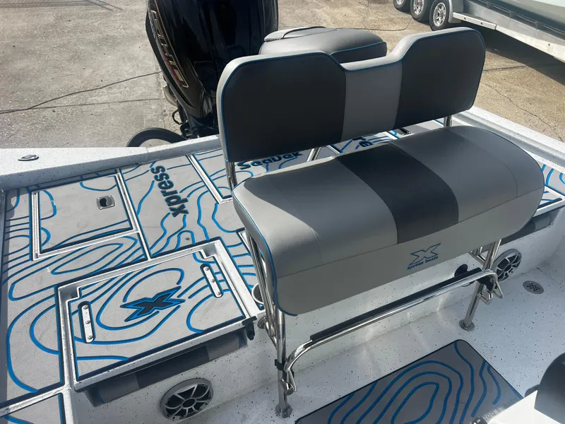Slide: The Image of 2023 Xpress X23B Lounge boat interior with stylish seating and modern design. - 14