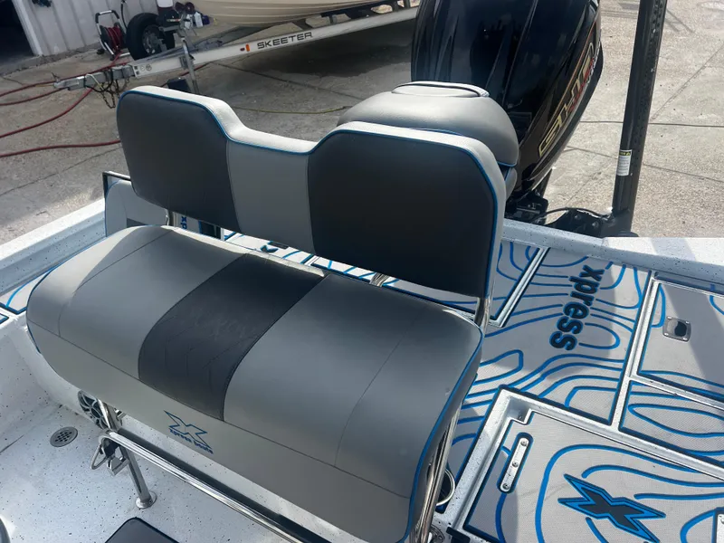 Slide: The Image of 2023 Xpress X23B Lounge boat interior with stylish seating and modern design. - 7