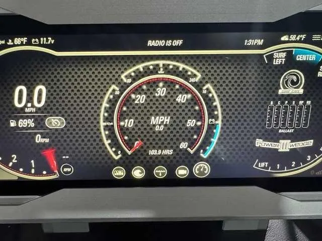 Slide: The Image of 2022 Malibu M240 dashboard display showing speedometer, RPM, and various controls. - 11