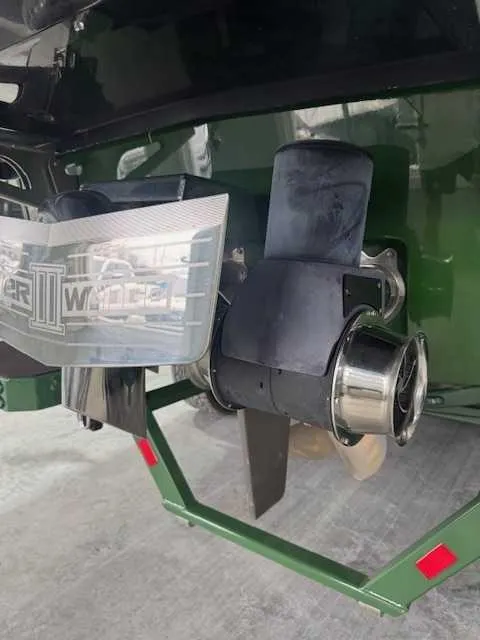 Slide: The Image of 2022 Malibu M240 boat propeller and exhaust system, close-up view. - 14