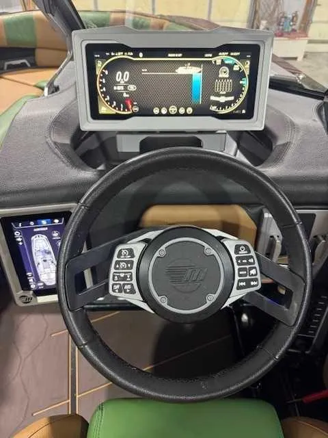 Slide: The Image of 2022 Malibu M240 dashboard with advanced digital display and steering controls. - 2