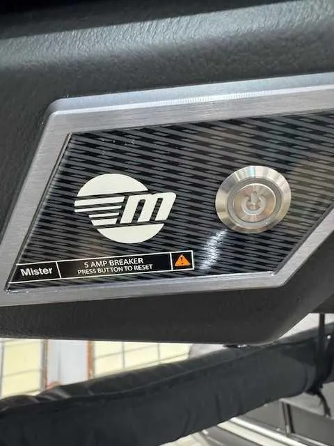 Slide: The Image of Control panel of a 2022 Malibu M240 boat with 5 amp breaker reset button. - 8