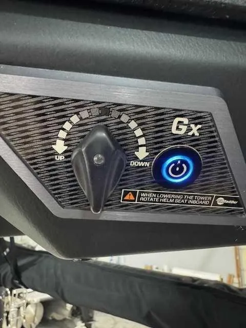 Slide: The Image of Control panel of a 2022 Malibu M240 boat with adjustment knob and power button. - 9