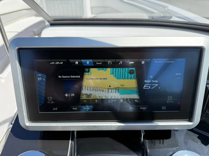Slide: The Image of Dashboard display of a 2022 Yamaha Boats 252SD, showing navigation and water temperature. - 12
